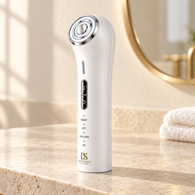 Dynamic Supreme NEXUS beauty device on a light stone bathroom countertop